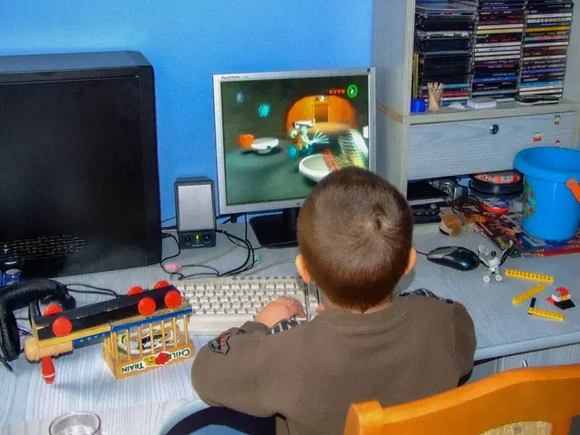Igor as a child playing at his first desktop computer